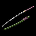 Handcrafted Japanese katana Dokuryu displayed on a black background in a separated composition, blade drawn from the scabbard showing folded steel with a visible wavy hamon, curved tip and exposed cutting edge, green lacquered wooden saya with speckled jungle-like texture placed below, purple tsuka wrapped in traditional cord with white ray skin panels visible, round metal tsuba engraved with a Japanese dragon, minimalist studio setting with no stand.

