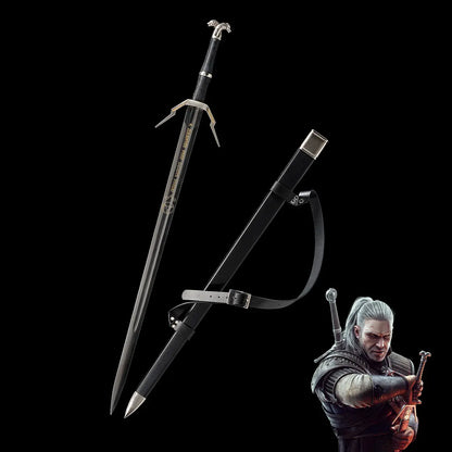 Geralt long sword replica displayed on a deep black background, blade unsheathed next to its black scabbard with leather belt strap attached. The sword features a straight double-edged steel blade with a central fuller and gold engraved inscription near the spine. The crossguard is angular and silver with extended quillons, the grip is wrapped in black textured leather, and the pommel is silver with a wolf head detail. The scabbard is matte black with a metal chape and locket in silver tone.  
