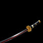 Détail de la garde (tsuba) en trèfle doré du katana Enma Black, réplique One Piece haut de gamme.