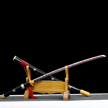 Katana japonais Enma Black dégainé, réplique One Piece de Roronoa Zoro, lame noire et rouge avec hamon décoratif.