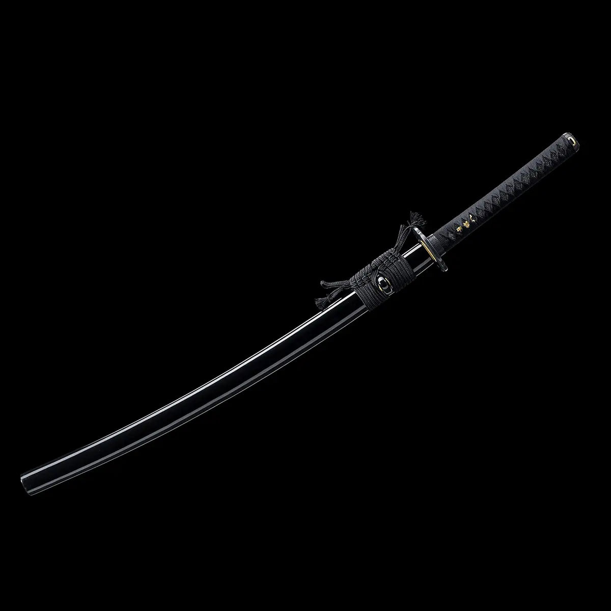 Full view of a Japanese katana displayed diagonally against a deep black background, black lacquered wooden scabbard fully enclosing the blade, black braided sageo tied around the saya, traditional black handle wrapped with black cord over ray skin, visible gold menuki under the wrap, subtle curvature of the sheathed blade emphasized, clean minimalist studio setting highlighting the classic katana silhouette.

