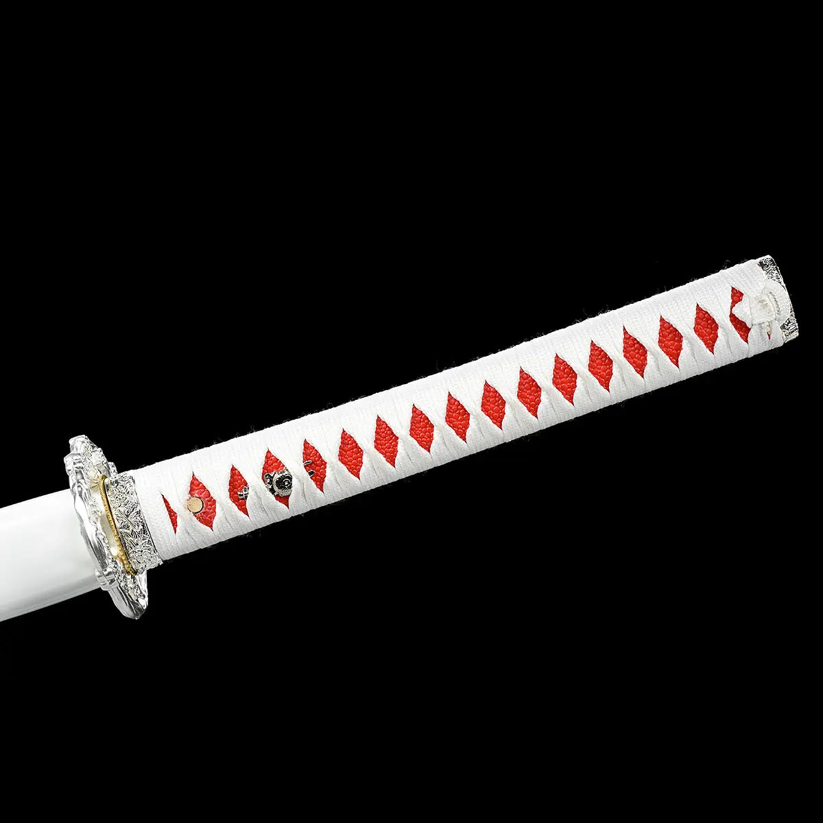 Close-up view of the handle of the Japanese artisanal katana Hana no Yuki on a solid black background, showing a white tsuka wrapped in white ray skin with a tight red ito diamond pattern, visible mekugi pins, silver-colored fittings near the guard, and the clean alignment of the handle wrapping without the blade visible
