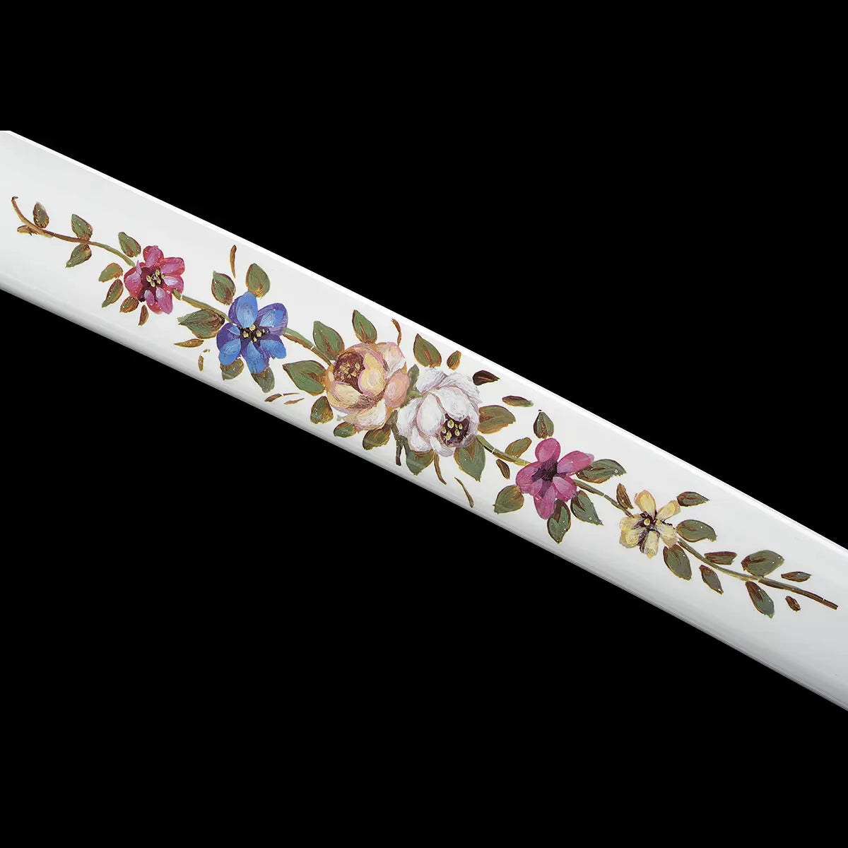 Close-up detail of the white lacquered saya of the Japanese artisanal katana Hana no Yuki on a solid black background, highlighting hand-painted multicolored floral motifs with green leaves, pink, blue, yellow, and white flowers, smooth glossy surface, and the gentle curvature of the scabbard without the blade visible

