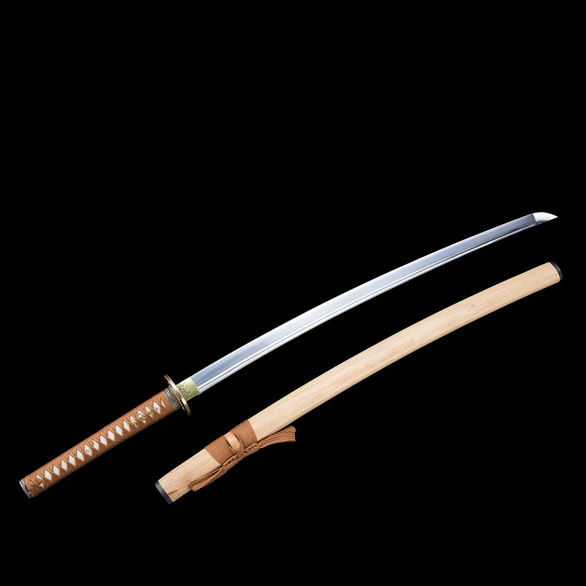 Full view of the Japanese artisanal katana Take no Kaze photographed on a deep black background, showing the blade and bamboo scabbard separated and aligned diagonally. The polished steel blade features a visible fuller and a defined curved kissaki. The natural light bamboo saya displays a smooth wood grain finish with a brown woven sageo tied around the kurigata. The handle is wrapped in brown synthetic leather ito over white ray skin, with a round dark metal tsuba and brass-colored habaki, highlighting th