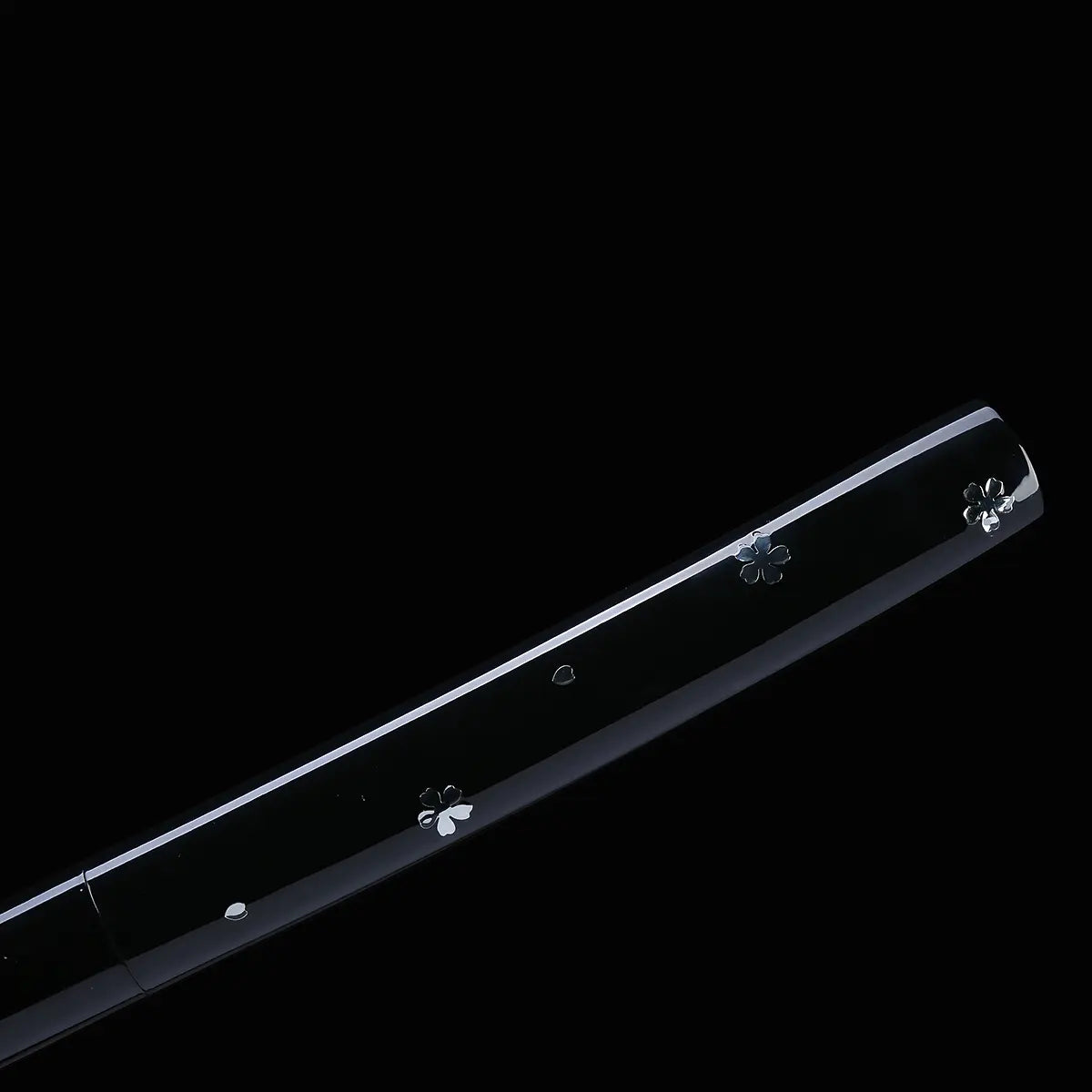 Close-up view of a Japanese cosplay katana shirasaya with a glossy black lacquered scabbard, displayed on a solid black background. The saya features metallic silver cherry blossom decorations along its length. The sheath is present, with no visible guard, showing a minimalist shirasaya design inspired by Japanese cinema.
