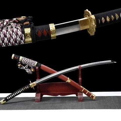 Japanese tachi katana Taiyo Taisho presented in a crossed composition on a traditional red wooden sword stand, showing the unsheathed curved steel blade with visible hamon crossing over the red lacquered saya with gold fittings, braided black white and red sageo cord resting near the handle, black tsuka with white ray skin panels and gold menuki, photographed in studio on a deep black background with a gray surface, highlighting curvature, balance, and traditional Japanese craftsmanship
